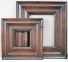 three wooden frames sitting next to each other