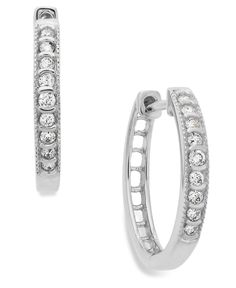 Take center stage in these channel-set hoop earrings. Crafted in 10k white gold with round-cut diamonds (1/6 ct. t.w.). Approximate diameter: 1/4 inch. Classic White Huggie Earrings With Diamond Accents, Classic Hoop Earrings With Single Cut Diamonds, Classic Cubic Zirconia Huggie Earrings, Classic Diamond White Hoop Huggie Earrings, Classic Silver Huggie Earrings Channel Set, Classic Silver Channel Set Huggie Earrings, Classic White Cubic Zirconia Hoop Earrings, Classic Huggie Diamond Earrings, Classic Diamond Huggie Earrings