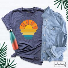 Retro Sunset Rays Wavy Shirt, Vintage Shirt, Retro Sunshine Shirt, Beachy Vibes Tee, Retro Summer Time, Sunset Tshirt, Sun Rays Tee. Hi! Welcome to our store. It's good to see you here. Our aim is to offer you first-class clothing in your most beautiful moments with our graphic t-shirts that we designed or designed with your ideas. I am sure you will like our designs for your family, friends and you. IMPORTANT MATTERS FOR ORDERING: 1-) Please check and review all photos. 2-) Our sizes are true t Blue Retro Tops For Beach Season, Retro Crew Neck Beach Shirt, Class Outfit, Good To See You, Retro Summer, Military Green, Baby Bag, Beautiful Moments, Vintage Shirts