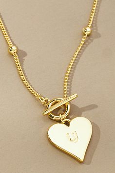 14k gold-plated brass Lobster clasp Imported | Touch of Love Necklace by Uncommon James in Gold, Women's, Gold/Plated Brass at Anthropologie Personalized Heart-shaped Gold Chain Necklace, Elegant Chain Necklace With Gold Clasp As Gift, Valentine's Day Gold-tone Adjustable Chain Necklace, Gold Brass Heart Charm Necklaces, Adjustable Gold Charm Necklaces With Heart Charm, Gold Brass Charm Necklace With Heart Charm, Adjustable Gold Plated Necklaces With Heart Charm, Gold-tone Jewelry With Heart Charm For Everyday, Gold-tone Brass Jewelry With Heart Charm