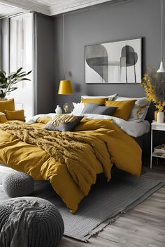 a bedroom with yellow and gray bedding