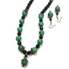 Artisan Green And Black Necklace Earring Set Green Stones This Is A Beautiful Hand Created One Of A Kind Jewelry Set - Made By Me Stunning Cold Green Stones And Black Faceted Glass Beads Drop Pendant Accented With Silver Bead Caps And Spacers Earrings Match Necklace - Topped With Sparkling Green Swarovski Crystals Necklace Is 19 1/2" - Pendant 1 1/4" Very Good Condition - See Photos! 3-2-21-A Pem Black Round Beads Jewelry Set As Gift, Black Round Beads Jewelry Set For Gift, Black Jewelry Set With Round Beads As A Gift, Black Jewelry Set With Round Beads For Gift, Black Necklace With Matching Earrings As Gift, Black Jewelry With Matching Earrings For Jewelry Making, Match Necklace, Black Stone Necklace, Crystals Necklace