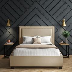 a bedroom with black walls and white bedding in the center, along with two nightstands on either side