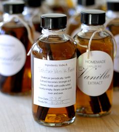 several bottles of homemade vanilla syrup sitting on a table with labels for each bottle and label