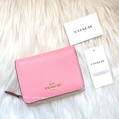 Color: Candy Pink Multi Material: Crossgrain Leather Condition: Brand New With Tag Style Number: 2923 Dimensions: 4" (L) X 3 1/4" (H) X 1 1/2" (W) Two Credit Card Slots Full-Length Bill Compartment Id Window Snap Closure Outside Zip Coin Pocket Our Crossgrain Leather Small Trifold Wallet Is Secured By A Snap Closure And Perfectly Organized To Hold Cards And Cash. 100% Authentic Price Is Firm Comes From Clean & Pet Free Environment Rare Find Sold Out Everywhere Pink Trifold Wallet For Everyday Use, Coach Trifold Wallet For Daily Use, Trendy Pink Coach Wallet, Saving List, Window Snap, Clear Backpacks, Color Candy, Perfectly Organized, List Ideas