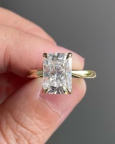 Classic 3 Ct Radiant Cut Moissanite Engagement Ring, Crushed Ice Radiant Cut Ring, Elongated Radiant, Solitaire Ring ♻︎𝐃𝐢𝐚𝐦𝐨𝐧𝐝 𝐃𝐞𝐭𝐚𝐢𝐥𝐬 ⇛𝐃𝐞𝐭𝐚𝐢𝐥𝐬 𝐨𝐟 𝐦𝐚𝐢𝐧 (𝐜𝐞𝐧𝐭𝐞𝐫) 𝐬𝐭𝐨𝐧𝐞 ⇒Type of Diamond: Moissanite/Cubic Zirconia ⇒Size: 9.00x7.00 mm ⇒Weight: 2.50 Ct ⇒Shape: Radiant ⇒Color: D (White/colorless) ⇒Clarity: VVS1 ⇒Cut: Excellent ⇒Band width : 2.0 mm ⇒Band thickness : 1.6 mm ⇛⇛𝗗𝗲𝘁𝗮𝗶𝗹𝘀 𝗼𝗳 𝘀𝗶𝗱𝗲 𝘀𝘁𝗼𝗻𝗲 ⇒Type of Diamond: Moissanite/Cubic Zirconia ⇒Shape: Taper Baguette ⇒Color: D (White/colorless) ⇒Clarity: VVS1 ⇒Cut: Excellent ♻︎𝗥𝗶𝗻𝗴 𝗦𝗶𝘇𝗲 ⇒From 4 US - 15 US all ring sizes are available, even half and quarter sizes are also available. Just for an example 4, 4 ¼, 4 ½, 4 ¾, 5 US. Kindly choose the perfect ring size while placing an order, you Radiant Cut Ring, Radiant Cut Moissanite Engagement Ring, Radiant Ring, Radiant Cut Rings, Dainty Wedding Ring, Wedding Rings Solitaire, Moissanite Jewelry, Engagement Ring Cuts, Hidden Halo