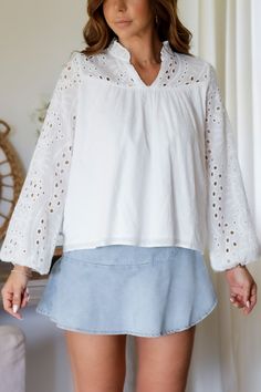 Add a touch of whimsy to your wardrobe with the Mandy Eyelet Blouse. Featuring delicate eyelet detailing, this blouse is sure to make you stand out. (Eyelet on point!) 65% Cotton 35% Polyester Color: White Long Sleeve Blouse All Over Eyelet Detail Light Weight Elastic Wrist Detail Double Lined in all the right placed Relaxed Flowy Style Ruffle Collar Detail Model is wearing a size Small. She is 5'6". 130lbs. Bust: 34" Waist 26" Hips 36" Spring V-neck Lace Top Blouse, Spring Cotton Lace Top With V-neck, Feminine Summer Eyelet Blouse, Spring Cotton V-neck Lace Top, Spring V-neck Cotton Lace Top, Cotton Lace V-neck Top For Spring, Casual Broderie Anglaise Top For Fall, Fall Casual Broderie Anglaise Top, Casual V-neck Eyelet Blouse