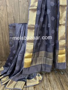 Deep color and rich soft fabric, pure Chanderi silk by cotton saree with Banarsi gold zari weaving. Color: Bluish Gray Fall attached. Matching blouse fabric included. Note: The color of the products may slightly vary according to the lighting conditions and the color calibration of the viewing LED devices. If you would like more clarity before your purchase, please drop us a message . Gold Cotton Silk Saree With Weaving Work, Gold Slub Silk Dupatta With Weaving Work, Gold Cotton Silk Dupatta With Handloom Details, Gold Cotton Silk Dupatta Handloom, Gold Cotton Silk Handloom Dupatta, Gold Chanderi Traditional Wear With Weaving Work, Gold Chanderi Dupatta With Weaving Work, Cotton Silk Dupatta With Zari Weaving For Celebration, Designer Dupatta With Weaving Work For Festivals