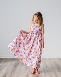 "Our girls sundress features a beautiful butterfly print on a soft pink background, a scoop neck, an elastic back waist and adjustable strappy neck tie.  Shown in a maxi length, our dress is also available in a midi or tea length.  The full skirt makes for fun twirling at birthday parties, family events, wedding receptions, church functions and other special events! Matching doll dresses can be added to your dress purchase by using the following listing:  https://www.etsy.com/listing/1598406363/ Pink Sleeveless Dress With Butterfly Print, Girls Midi Dress, Fond Rose Pale, Floral Meadow, Birthday Summer, Girls Sundress, Modesty Fashion, Doll Dresses, Wedding Receptions