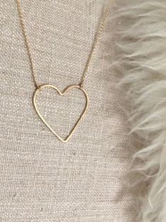 "Open Heart Necklace:  * Beautiful premium 14 karat gold-filled or sterling silver heart is hand-shaped and forged lending to the artisan quality that we love. * Choose your pendant size Regular heart: approximately 1\" Large heart: approximately 1.375\"W x 1.5\"H * Dainty and light Rolo chain gives this necklace a modern, smooth look that is so pretty. It's a perfect match for the elegant open line style heart pendant. * Comes in 17\" length chain with an option to add a 2\" extender chain. Ple Open Heart Necklace, Large Heart, Classic Elegant, Open Heart, Rolo Chain, Sterling Silver Heart, Jewelry Gift Box, Silver Heart, Timeless Style