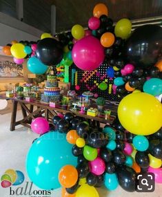 an assortment of balloons and streamers are on display at a birthday party or celebration