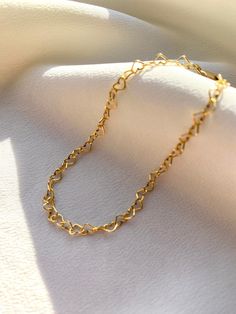 Delicate 14kt gold filled heart chain bracelet. The delicate and minimalist design of this link bracelet goes well with both casual and sophisticated looks. Wear it on its own or layered with other bracelets in our shop. Perfect for a gift! ✦ MATERIALS ✦ 14kt gold filled heart chain and lobster claw clasp. ✦ SIZING ✦ Available in 3mm width. ✦ PACKAGING ✦ All orders are packed in jewelry boxes/pouches with a brand logo, which makes it perfect for gifting. All packaging materials including mailers Minimalist Heart Pendant Bracelet, Gold Heart Bracelet With Adjustable Chain, Minimalist Heart Bracelet With Adjustable Chain, Minimalist Heart Bracelet With Adjustable Chain For Everyday, Delicate Heart Bracelet With Delicate Chain For Everyday, Delicate Heart Bracelet With Chain For Everyday Wear, Everyday Gold Heart Bracelet With Adjustable Chain, Minimalist Everyday Heart Bracelet With Adjustable Chain, Dainty Heart Shaped Adjustable Chain Bracelet