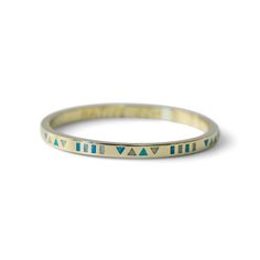 A 14K gold vermeil bangle with hand-inlaid blue and white opal from Native Gem. Gold Opal Stackable Jewelry, Symbolic Yellow Gold Bangle Jewelry, Blue Brass Bracelet, Gold Bohemian Jewelry With Inlay, Spiritual Gold Jewelry With Inlay, Bohemian Gold Jewelry With Inlay, Bohemian Bracelet, Green Rings, Bohemian Bracelets