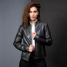 Upgrade your outerwear with our Black Women's Fashion Leather Jacket, available exclusively at LooksVillage. Crafted from premium sheepskin leather, this jacket combines rugged durability with sleek style. The beautiful design offers both warmth and comfort, while the full-length zipper ensures a snug fit, perfect for chilly days. At LooksVillage, we pride ourselves on delivering high-quality products and exceptional customer satisfaction. We ship internationally, so no matter where you are, you Fashion Leather Jacket, Stylish Leather Jacket, Womens Black Leather Jacket, Timeless Basics, Leather Jacket Style, Black Women Fashion, Leather Motorcycle Jacket, Sleek Fashion, Jacket Design