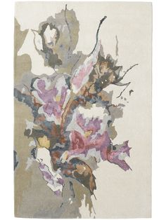 an abstract floral design on a white rug with pink and purple flowers in the center