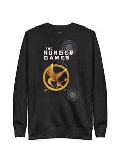 "I want the audience to recognize you when you’re in the arena," says Cinna dreamily. "Katniss, the girl who was on fire." This unisex sweatshirt features the first edition cover for The Hunger Games by Suzanne Collins. Product Details 65% cotton, 35% polyester Self-fabric patch on the back Direct-to-Garment printing Color: black Size & Fit Available in sizes S-3XL Snug fit This print-on-demand product is made especially for you as soon as you order it. The Print Shop: FAQs Ordering & Shipping W Book Socks, Sweatshirt Print, Suzanne Collins, The Arena, The Hunger Games, The Hunger, Fabric Patch, Kid Tees, The Girl Who