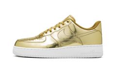 The Women’s Nike Air Force 1 “Metallic Gold” is the iconic low-top sneaker in a flashy and luxurious colorway.  Releasing as part of Nike’s “Liquid Metal” collection of Air Force 1 Lows, the look features a premium, shiny gold leather finish applied to the entire upper.  A tonal outlined Swoosh covers the mid-panel, while the heel features classic Nike Air detailing in a darker hue.  Tonal laces and a mini “AF1” emblem on the throat of the shoe are complimented by a white midsole with Air brandi Womens Air Force 1, Metallic Gold Shoes, Gold Nike, Nike Snkrs, Tenis Nike, Nike Gold, Liquid Metal, Nike Air Force 1 Low, Gold Shoes