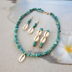 Turquoise Ocean-inspired Jewelry For Vacation, Ocean-inspired Turquoise Jewelry For Vacation, Handmade Turquoise Beachy Jewelry, Turquoise Beaded Shell Jewelry, Summer Turquoise Shell Jewelry, Turquoise Shell Strand Jewelry, Turquoise Shell-shaped Jewelry For Vacation, Turquoise Shell Necklace Summer Gift, Handmade Turquoise Beach Jewelry