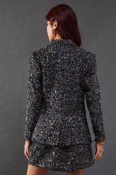 Dazzling sequin-embellished boucle fabric for a luxurious texture
Tailored blazer silhouette with a single-button closure
Notched lapels and long sleeves for a classic look
Versatile design suitable for both formal and casual occasions
Coordinating mini skirt available for a complete ensemble
Make a statement with this eye-catching sequin boucle blazer from Warehouse. The intricate sequin detailing adds a touch of glamour to the classic blazer silhouette, perfect for those who want to stand out from the crowd. Pair it with the matching mini skirt as seen on the model for a coordinated look that's sure to turn heads at your next night out. For a more versatile approach, style it with tailored trousers and a simple camisole for an elevated office-to-evening ensemble. The blazer's structure Lace Skater Dress, Boucle Fabric, Classic Blazer, Floral Outfit, Tailored Blazer, Tshirt Skirt, Halterneck Dress, Going Out Dresses, Tailored Trousers