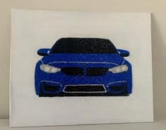 a blue car is shown on a white canvas