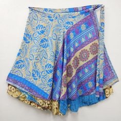 Indian Vintage Silk Wrap around magic long skirts for women, its free size wraps Reversible Tie skirts. Our skirt is handmade by our artisans in India out of recycled saris and turned into the beautiful finished skirt you see. With your help, these artisans are able to sustain year-round employment. Every skirt is truly an original made with exotic reclaimed materials. This skirt has the unique combination of designs and final touch of thread work on its corners which makes the product look arti Multicolor Wrap Skirt For Festivals, Traditional Flowy Wrap Skirt For Festival, Bohemian Skirt For Navratri, Traditional Tiered Wrap Skirt For Festival, Bohemian Flowy Skirt Bottoms For Festive Season, Multicolor Belly Dance Skirt For Festivals, Bohemian Skirt With Traditional Drape For Festive Occasions, Traditional Multicolor Long Wrap Skirt, Blue Bohemian Flowy Wrap Skirt