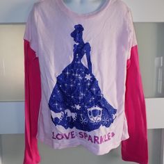 a t - shirt that says love sparkler hanging on a rack in a closet