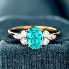 an oval cut blue topaz and diamond ring