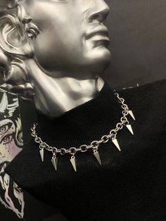 "Welcome to this listing for our awesome stainless steel alt studded necklace! - 7 Alt Stud charms - Stainless steel chain (Amazing thick quality!) - Fastened together with lobster clasp at back of necklace - Necklace available in various lengths - 14\" INCHES (CHOKER STYLE FIT) - 16\" INCHES - 18\" INCHES - 20\" INCHES NECKLACE COMES IN AUTBOX ORGANZA GIFT BAG IF YOU WOULD LIKE A SHORTER OR LONGER NECKLACE JUST MESSAGE AND WE WILL BE HAPPY TO CHANGE THE LENGTH. WE HAVE MATCHING BOOT CHARMS AND CHAINS GO AND TAKE A LOOK! IF YOU HAVE ANY QUESTIONS POP ME A MESSAGE, IM ALWAYS HAPPY TO HELP." Metal Choker With Adjustable Chain For Concerts, Nickel Free Stainless Steel Punk Necklace, Punk Stainless Steel Nickel-free Necklace, Punk Necklace With Adjustable Chain For Concert, Punk Style Silver Choker For Festivals, Punk Style Necklace With Adjustable Chain For Concerts, Edgy Festival Jewelry With Chain Detail, Punk Style Necklace With Adjustable Chain For Streetwear, Edgy Festival Jewelry With Chain