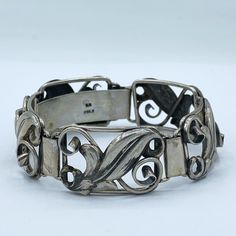 Vintage Norwegian mid-century 830 silver statement bracelet, featuring graceful leafy design. Marked 830S for silver and Signed BH. Measures - 7 3/4 inches long, 19.69 cm Width - 3/4 an inch, 1.91 cm Weight - 33.54 grams.  CONDITION: Great. See pictures for details. If you like what you see here please take a moment to check out the other vintage and antique bracelets I have for sale. I combine shipping costs for multiple purchases. Wedding Bracelets, Antique Bracelets, Wedding Jewelry Bracelets, Statement Bracelet, Wedding Bracelet, Designer Jewelry, Norway, Wedding Jewelry, Silver Bracelet