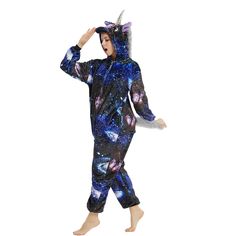 a person in a blue and black animal onesuit is holding his head to his hair