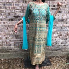 Beautiful Turquoise And Gold Salwar Kameez Two Piece Indian Outfit. Brand New Never Worn. Has Cups Sewn In At The Chest. Beautiful Swarovski Type Gold Stones Add Some Bling. Two Tone Gold And Turquoise Embroidery. Comes With Pants And Duppata! Mendhi, Wedding, Sangeet. Waist Free Size. Dress: Chest Up To 45”, Waist Up To 42”, Hip Up To 46”. Length Of Dress Up To 50”. Length Of Pants Up To 52”. Turquoise Anarkali Kurta For Eid, Anarkali Turquoise Kurta For Eid, Anarkali Kurta In Turquoise For Eid, Turquoise Sharara With Resham Embroidery For Eid, Turquoise Kurta With Dabka Work For Eid, Turquoise Dabka Work Sets For Eid, Unstitched Turquoise Salwar Kameez With Resham Embroidery, Eid Turquoise Kurta With Dabka Work, Turquoise Resham Embroidered Kurta For Eid