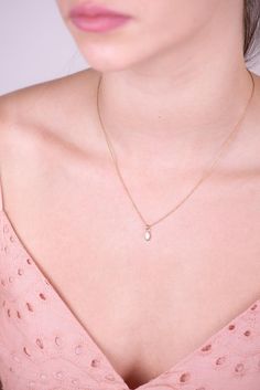 ALL 14K SOLID GOLD!Handmade with Love 14k gold small dia drop pendant hangs on a fine 14k gold woven chain. Handcrafted Delicate necklace.►Material:♦ 14K Yellow GOLD - NOT plated or gold filled!!!►Measurements:♦ Necklace length: 45 cm (17.71")♦ Necklace width: 0.039" inch (1 mm)♦ Pendant Drop Size : 7.37* 3.8 mm ____________________________________________________________♥ Everything in my shop is handmade by me with lots of love and care. It involves the use of raw materials such as metals and White Teardrop 14k Gold Necklaces, Gold Birthstone Necklaces, Oval Drop Necklace Fine Jewelry Gift, 14k Gold Birthstone Necklaces, 14k Gold White Gemstone Necklace, 14k Gold Oval Pendant Necklace For Wedding, Dainty Diamond Necklace With Pearl Pendant For Gift, Oval Pendant Necklace In 14k Gold For Wedding, Yellow Gold Gemstone Charm Necklace