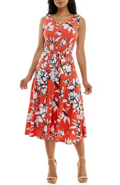 A vibrant printed midi dress is perfect for summer events. Fit: this style fits true to size. 50" length (size Medium) Crewneck Sleeveless Attached waist tie 95% polyester, 5% spandex Machine wash cold Imported Model stats: 5'10", 32" bust, 25" waist, 36" hip. Model is wearing size Medium. Sleeveless Midi Dress For Summer Garden Party, Casual Sleeveless Printed Midi Dress, Casual Printed Sleeveless Midi Dress, Orange Midi Sleeveless Dress For Beach, Sleeveless Printed Midi Dress For Spring, Spring Sleeveless Printed Midi Dress, Printed Knee-length Midi Dress For Summer, White Summer Midi Dress With Tie Waist, Printed Sleeveless Midi Dress For Spring