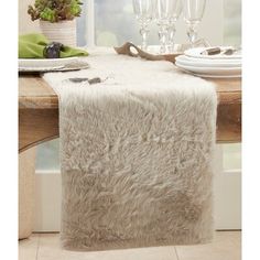 Greyleigh™ Whether it's an upscale dinner party or a festive family feast, this bold table runner adds a twist of old Hollywood glamour to your dining table. The soft faux fur design is the perfect conversation piece by adding eye-catching texture and visual interest. Crafted from 100% soft polyester for durability and available in neutral, solid colors to coordinate easily with decor and dinnerware. We recommend hand washing or dry cleaning. Color: Gray, Size: 72" x 15" | Greyleigh™ Branchville Faux Fur Table Runner, Fur Table Runner, Fur Table, Dining Table Bench Seat, Fur Design, Winter Table, White Dinnerware, Family Feast, Dining Table With Bench