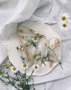 some flowers are laying on a plate