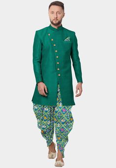 Readymade Art Silk Sherwani Dhoti Set in Teal Green. This Chinese Collar and Full Sleeves attire with Satin Lining is Enhanced with Patola Printed With Animal Motif Dhoti and Top Enhanced With Buttons, Printed Pocket Square And Side Pockets. Available with a Art Silk Dhoti Pant in Sea Green. Do note: Footwear shown in the image is for presentation purposes only. Half to one inch may vary in measurement. (Slight variation in actual color vs. image is possible) We sell all kinds of menswear. Mens Patola Kurta For Men, Ceremonial Pista Green Kurta With Zari Work, Ceremonial Pista Green Kurta With Pallu, Green Ceremonial Kurta For Navratri, Ceremonial Green Kurta For Navratri, Green Bandhgala With Zari Work For Navratri, Pista Green Ceremonial Kurta For Diwali, Traditional Bandhgala With Cutdana For Diwali, Pista Green Kurta For Diwali