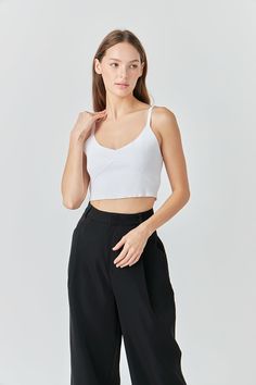 Add a touch of luxury to your everyday look. Made with a soft and comfortable knit fabric, this top is perfect for layering or wearing on its own. With delicate shoulder straps and a fitted silhouette, this top will add some glamor to any outfit. Wear it with jeans and a blazer for a night out, or dress it up with some trousers for work. Cropped length Shoulder straps Fitted silhouette Hand wash cold Do not bleach Do not tumble dry Iron low Shell: 60% Viscose 40% Nylon JJ568T Total length: 15" Bust: 27" S Knitted Bralette, Jumpsuit Fall, Bralette Top, Knit Bottom, Tweed Dress, Blazer And Shorts, Bralette Tops, Heat Styling Products, Tops Fall