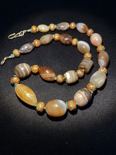 Traditional Agate Beaded Jewelry, Traditional Agate Gemstone Beads Jewelry, Traditional Oval Beads Gemstone Necklace, Traditional Agate Bead Oval Necklaces, Traditional Agate Necklace With Oval Beads, Traditional Gold Agate Necklace, Traditional Gold Agate Beaded Necklaces, Traditional Oval Beads Agate Jewelry, Traditional Oval Beaded Agate Jewelry