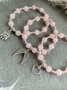 𝑅𝑜𝓈𝑒 𝒬𝓊𝒶𝓇𝓉𝓏  Handmade bracelet using Rose Quartz crystal 8mm beads and silver plated spacer beads with any choice of charm 💗 (Please state in personalisation box or note to seller which charm you would like if not listed) 𝑅𝑜𝓈𝑒 𝒬𝓊𝒶𝓇𝓉𝓏 is a peaceful and loving crystal and the stone of universal love. It restores trust and harmony in relationships, encouraging unconditional love. Rose Quartz purifies and opens the heart at all levels to promote love, self-love, friendship, deep Vday Bracelets, Self Made Bracelets, Gem Bracelets, Hand Jewelry Rings, Anting Manik, Rose Quartz Bracelet Beads, Gelang Manik-manik, Bracelet Inspo, Rose Quartz Jewelry