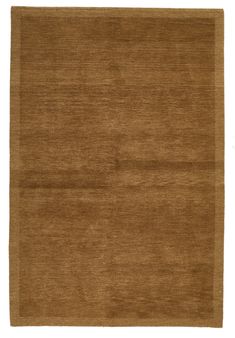 a brown rug on a white background with no one in the room to see it