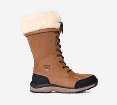 Your way to a classic winter wonderland just got unlocked with the Adirondack Boot Tall. It's one of our longest-running chilly season styles for a reason. Like its cousin, the Adirondack Boot -- our tall version provides even more winter tech warmth. The waterproof Adirondack has a flexible White Spider Rubber outsole to help you stay sturdy. With extra warming insulation, a cushioning insole, and a cold-weather rating of -32C, this boot was born in the cold to keep you warm. | Waterproof. Waterproof membrane bootie construction. Waterproof leather. Waterproof suede. Gusseted tongue with water repellent coating. Cuffable shaft. Non-wicking laces. 8mm fluff poly knit fabric lining. 17mm UGG®plush 80% upcycled wool, 20% TENCEL Lyocell insole or 17mm UGG®plush 60% upcycled wool, 40% TENCEL L Ugg Hiking Boots, Adirondack Ugg Boots, White Spider, Cold Weather Boots, Weather Boots, Cold Weather Fashion, Tall Boot, Stylish Boots, Sherpa Lined