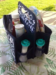 a close up of a bag on a table with bottles and containers in the back