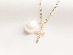 Tiny Cross with Pearl Necklace / Miraculous Necklace / Pearl / Catholic Necklace / Gold Necklace with Cross / Baptism / Gold Filled - Gold Filled 8X15mm Cross Charm - Baroque Pearl - Material: 14k Gold Filled AVAILABLE LENGTH + 16 inches Round Flat Gold Filled + 17 inches Round Flat Gold Filled + 18 inches Round Flat Gold Filled - Pendant and Chain Material: Gold Filled - Water-resistant, tarnish free, hypoallergenic, nickel free and safe for sensitive skin Please note: since our baroque pearls Pearl Drop Cross Necklace Gift, Pearl Drop Cross Pendant Necklace For Gift, Elegant Cross Necklace For Confirmation, Elegant Personalized Necklace For First Communion, Gift Pearl Charm Cross Pendant Necklace, Pearl Charm Cross Necklace For Gift, Cross Necklace With Pearl Charm For Gifts, Cross Necklace With Pearl Charm As Gift, Handmade Cross Pendant Necklace For Weddings