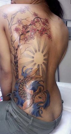 a woman with a tattoo on her back