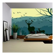 this is an image of a bedroom with deer and birds on the wall in front of it