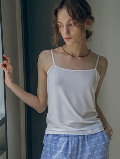 This is vanone atelier’s sleeveless top is perfect for hot summer days and is designed to be versatile for various styles. It comes in the most versatile color options to complement a wide range of outfits. With excellent stretchability, it provides comfortable wear, and the shoulder straps can be adjusted to fit your body.- Ideal for daily wear- Can be paired with different styles of bottoms to create various looks- A basic item that can be easily styled with any outfit Summer Vest With Built-in Bra And Spaghetti Straps, Casual Summer Vest With Built-in Bra, Summer Tops With Spaghetti Straps And Built-in Bra, White Sleeveless Camisole With Built-in Bra, Sleeveless Stretch Tank Top For Summer, Sleeveless Stretch Tops For Summer, Stretch Sleeveless Tank Top For Summer, Summer Tops With Built-in Bra And Tank Straps, White Tank Top With Built-in Bra For Day Out