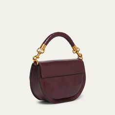 Chloe "Marcie" crossbody bag in shiny calfskin leather  Detachable top handle  Detachable chain/leather crossbody strap Can be worn as a top handle or crossbody bag  Flap top with magnetic closure  Interior, one slip pocket  Lining: Leather Approx. 6.2"H x 8.9"W x 2.8"D Made in Italy Evening Crossbody Saddle Bag With Detachable Handle, Evening Crossbody Saddle Bag With Top Carry Handle, Evening Saddle Bag With Top Carry Handle, Evening Saddle Bag With Detachable Strap And Double Handle, Top Handle Saddle Bag With Removable Pouch, Evening Saddle Bag With Top Handle And Removable Pouch, Luxury Satchel With Chain Strap And Top Handle, Leather Satchel With Chain Strap And Top Handle, Formal Top Handle Saddle Bag With Gold-tone Hardware