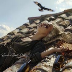 a woman laying on top of a tiled roof