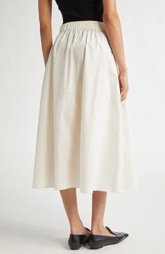 From McManus's prefall '24 collection, this partially pleated sateen skirt features fullness and movement to create subtle yet sweeping entrances. 32 1/2" length (size Medium) Back elastic waist Side-seam pockets 100% organic cotton Dry clean or hand wash, flat dry Made in Portugal Designer Clothing Cream Pleated Tiered Skirt, Cream Pleated Lined Skirt, White Midi-length Accordion Pleated Skirt, White Midi Length Accordion Pleated Skirt, Cream Pleated Flowy Flared Skirt, Cream Gathered Midi Skirt, Accordion Pleated Full Skirt For Daywear, Accordion Pleats Full Skirt For Daywear, Elegant Cream Pleated Skirt