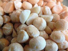 a pile of sugar coated peanuts sitting on top of a table